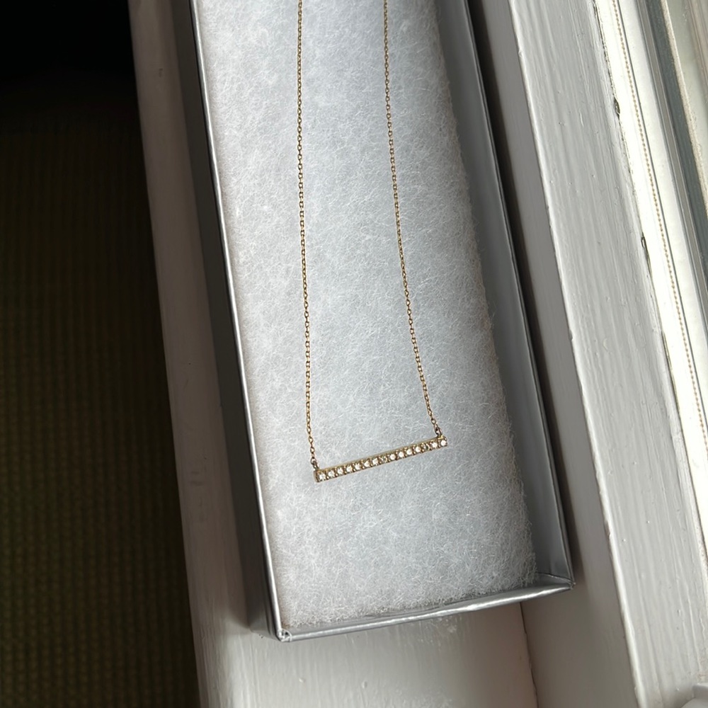 BAR necklace with fake diamonds. Gold color, not real gold. Great condition worn